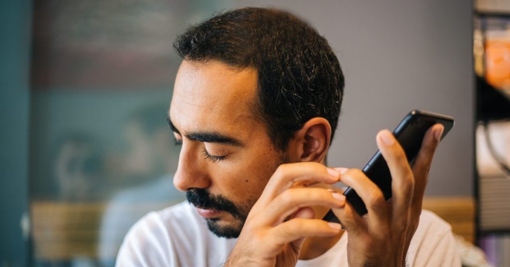 AI for Accessibility - Blind man listening to phone