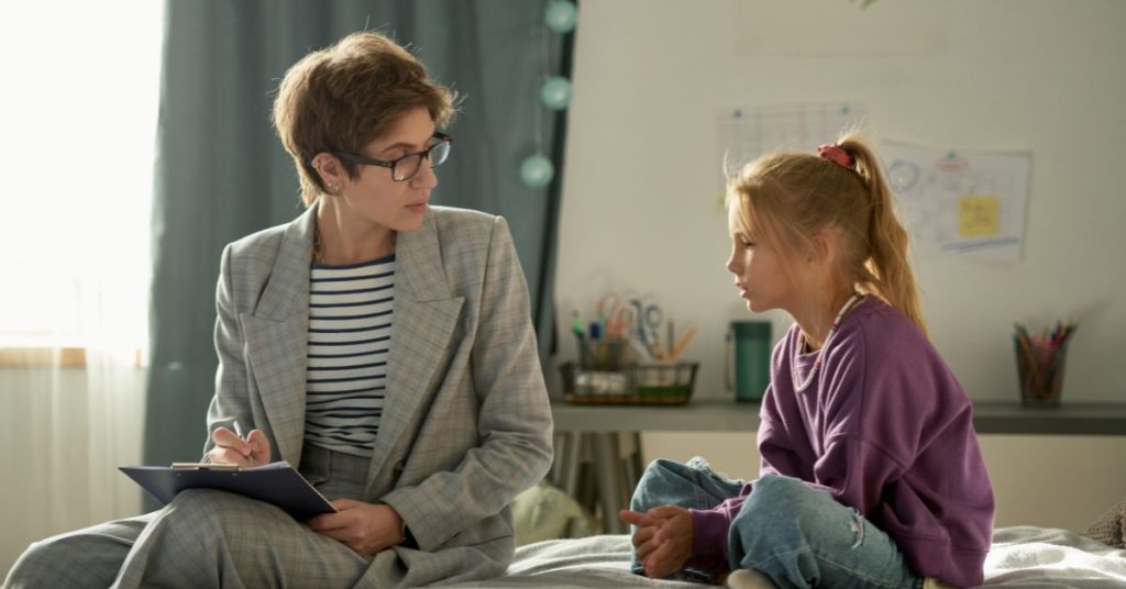 Social worker with child