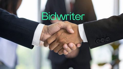 Business people shaking hands after signing contract with Bidwriter