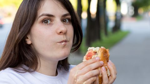 Woman eating sandwhich